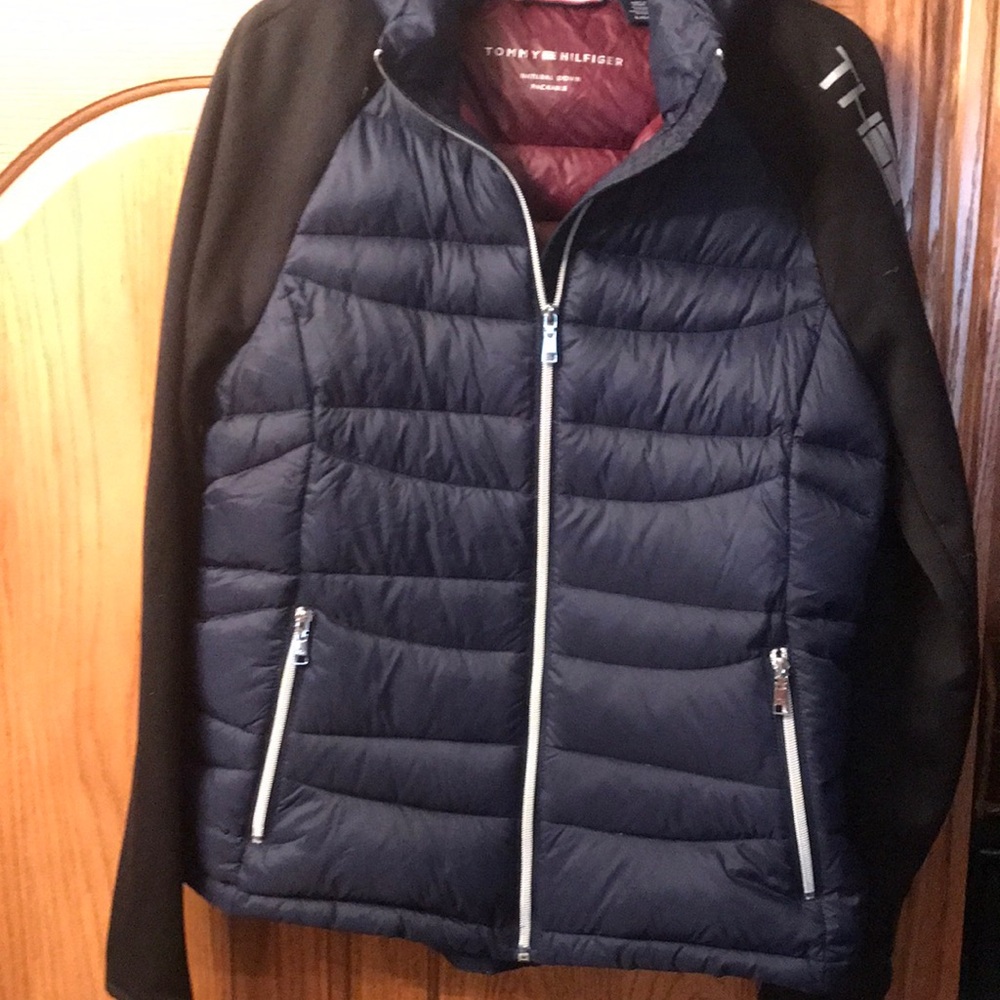 Natural down. Ladies jacket with storage nylon bag attached.